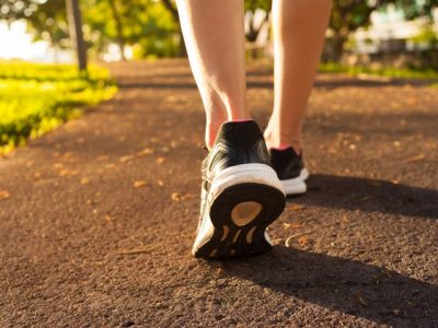 Woman Walking On A Path